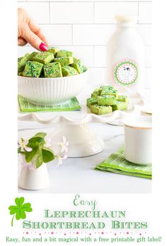 a white plate topped with green shortbreads on top of a table