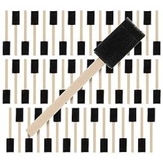 a black and white checkered table cloth with a wooden spatula on top of it