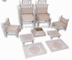 a set of chairs and tables with matching rugs