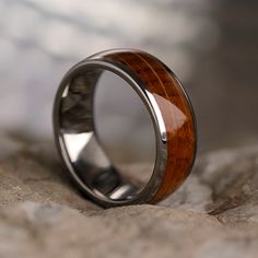 Wood from barrels used in real Tennessee whiskey casks has been inlaid into titanium on this whiskey oak wood ring. This wooden jewelry has an interesting history and makes for an excellent conversation piece. Perfect for whiskey enthusiasts, this whiskey barrel wood and titanium ring is in stock and ships in 3-5 days! Vintage Engagement Ring Settings, Jewelry By Johan, Leaf Engagement Ring, Titanium Wedding Band, Yellow Engagement Rings, Tennessee Whiskey, Unique Diamond Rings, Sapphire Engagement Ring Blue, Morganite Engagement