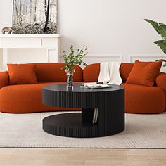 a living room with an orange couch and coffee table