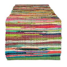 a multicolored rug is shown on a white background and it's very colorful