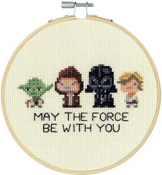 a cross stitch pattern with the words may the force be with you and two small cartoon characters