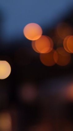 blurry image of street lights in the background at night with bokeh effect