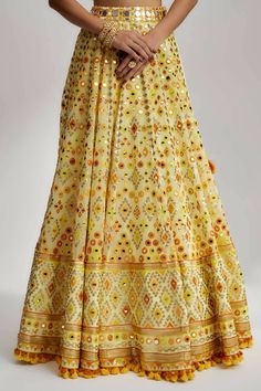 The Esha Lehenga also boasts detailed hand and machine embroidery, showcasing exquisite craftsmanship. Skilled artisans have meticulously adorned the fabric with intricate patterns and motifs using fine threads, sequins and beads. The combination of hand and machine embroidery adds depth and dimension, elevating the lehenga to a work of art. Bollywood Multicolor Embroidered Anarkali Set, Bollywood Style Multicolor Embroidered Anarkali Set, Festive Multicolor Embroidered Lehenga With Zari Work, Yellow Chinon Traditional Wear With Intricate Embroidery, Multicolor Embroidered Georgette Anarkali With Mirror Work, Georgette Anarkali Set With Multicolor Embroidery And Mirror Work, Multicolor Embroidered Anarkali Set With Mirror Work, Festive Anarkali Set With Intricate Multicolor Embroidery, Multicolor Embroidered Lehenga For Festive Occasions