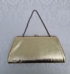 No tags.  Good vintage condition.  Light wear to metal frame.   10 inches by 4 1/2 inches.  When closed, the widest part is approximately 1 1/2 inches thick.  Chain strap has 5 1/2 inch drop. Vintage Rectangular Clutch For Events, Vintage Rectangular Clutch With Chain Strap, Retro Gold Rectangular Shoulder Bag, Retro Rectangular Bag For Events, Classic Gold Evening Bag With Chain Strap, Retro Rectangular Event Bag, Classic Gold Rectangular Clutch, Vintage Gold Clutch With Chain Strap, Retro Gold Rectangular Evening Bag