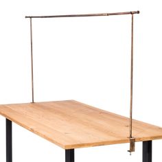 a wooden table with two metal legs and an iron bar on top