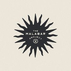 a black and white logo with the words the malabr project on it's side