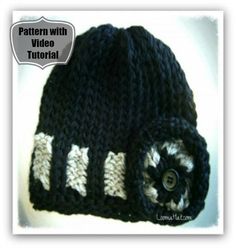 a crocheted hat with buttons on it is shown in black, white and gray