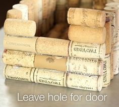 several wine corks stacked on top of each other in front of the words leave hole for door