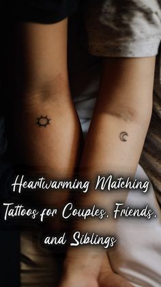 two people holding hands with tattoos on their arms and the words, heartwarming matching tattoo