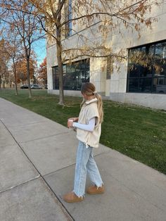 fall outfit, denim, light wash, uggs, sherpa, vest outfit, fall 2024, back to school, white top, basic outfit, style, women’s fashion, balayage, mug, fall season, board ideas White Winter Vest Outfits, Cloudy Fall Day Outfit, White Denim Outfit Winter, Passion Outfit Ideas, Stone Outfit Ideas, Cream Sherpa Vest Outfit, Ugg Clogs Outfit Fall, White Fluffy Vest Outfit, Fall Outfits Women Sweaters