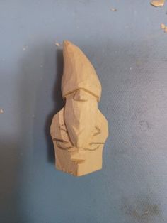 a piece of wood carved to look like a human head