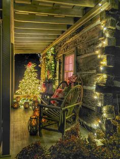 a porch decorated with christmas lights and decorations