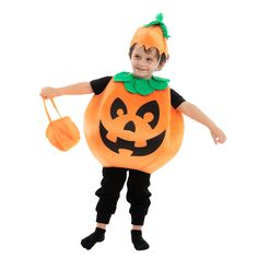 a young boy dressed in an orange pumpkin costume and carrying a bucket with his hands