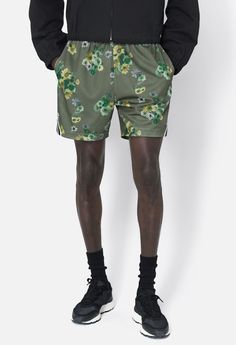 Hoops-inspired mesh shorts in a relaxed and slightly cropped fit. Custom 'Camo Bloom' print. Two pocket styling with a ribbed drawstring waist and double taped side trim with vented cuffs. Fully lined. 100% Poly. This style fits similar as our 'AAU' and 'Practice' Short silhouettes, an intentionally smaller and more tailored fit than 'Game Shorts. Spring Athletic 2-in-1 Relaxed Fit Shorts, Relaxed Fit Athletic Shorts For Spring, Spring Streetwear Shorts With Elastic Waistband, Summer Streetwear Athleisure Bottoms, Summer Athleisure Streetwear Bottoms, Green Bottoms For Summer Streetwear, Green Summer Streetwear Bottoms, Spring Athletic Shorts With Built-in Shorts, Green Athletic Shorts With Elastic Waistband For Spring