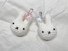 two crocheted keychains with bunny ears on them