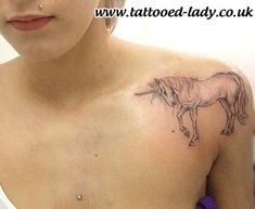 a woman with a unicorn tattoo on her chest