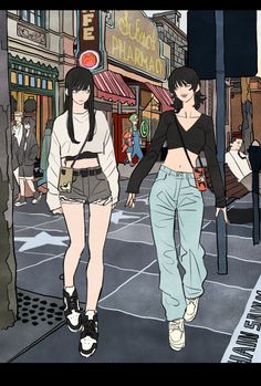 two women walking down the street in front of shops