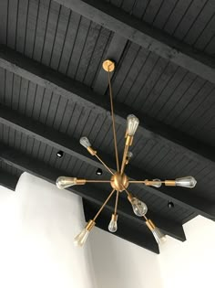 a chandelier hanging from the ceiling in a room