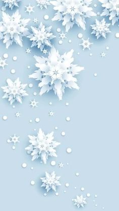 snow flakes are falling down on a blue background