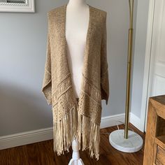 Zara Open-Work Taupe Knit Cardigan With Long Fringe In A Bohemian Style. Side Slits. Size M (Only One Size). Never Used. One Size Cream Knit Outerwear, One Size Beige Knit Cardigan, One Size Beige Sweater For Layering, One Size Fringe Sweater For Fall, One Size Knit Outerwear For Layering, Open Front Sweater For Layering, One Size Open Front Sweater For Layering, Zara Soft Knit Cardigan For Fall, One-size Knit Sweater Coat For Layering