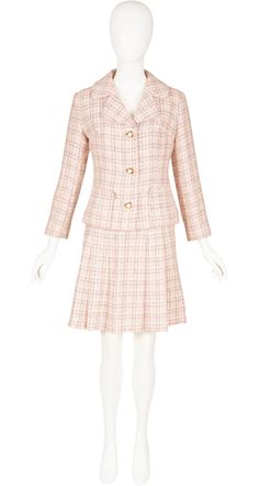 "This 1960s Cacharel skirt suit has the rare early \"Jean Cacharel\" label. It was made of baby pink, gray, and white plaid wool (likely a blend) that fastens with square gold-tone metal buttons with pink accents. The jacket is lined, with two front pockets, three buttons in the front and three decorative buttons on each cuff. The pleated skirt is unlined, and fastens up the side with a metal zipper and hook-and-eye at the waistband. The set is in very good condition, has been professionally dry-cleaned and is ready to wear. Measurements: Jacket: Bust - 35\" Waist - 30\" Shoulders - 15.5\" Sleeves - 21\" Length - 21\" Skirt: Waist - 24\" Hips - 35\" Length - 20\" IMPORTANT NOTE FOR CANADIAN SHOPPERS: There is a 15% shipping fee that is automatically applied to Canadian orders, as legally w 1960s Suit Women, Mariko Nakasu, 1960s Suit, Pink Skirt Suit, Wool Pleated Skirt, 60’s Fashion, 60s Women, 1960s Outfits, Romper Suit