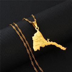 Express your love for Eritrea with this map pendant necklace.  Everyday wear for both Women and Men. 18K Gold-Plated Eritrean Map Necklaces  Pendent hung on a 23.7-inch gold chain  Chain Type: Water-Wave Metal: Stainless Steel Gold Color Plated Please Note:  This product is costume jewelry, it is not pure gold. Gold Necklace For Men, Gold Map, Anniversary Necklace, Necklace Everyday, Map Pendant, Map Necklace, Pendent Necklace, Cool Necklaces, Gold Pendant Necklace