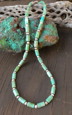 This Navajo turquoise necklace is a classic Native American accessory that you've been searching for. It is handcrafted with beautiful Turquoise beads feature subtle variations of green/blue. This is that boho-chic accessory that will enhance your casual or dressy wardrobe. Measures: 17 1/4" toggle closure Beads vary from 1/4" Weight:15 grams Thank you for shopping with Highway 66 Treasures! 😊 Please note: Most items are vintage. I clean and polish every item I ship due to concerns about germs etc... If you want your purchase left "as is" let me know before shipment. Keep in mind, that means fingerprints etc. In my opinion it's better to polish and if you want the item to tarnish, just leave it on your windowsill for a couple of weeks without wearing. Cheap Turquoise Long Beaded Necklace, Southwestern Green Turquoise Necklace, Adjustable Southwestern Green Turquoise Necklace, Southwestern Single Strand Green Turquoise Necklace, Southwestern Green Single Strand Turquoise Necklace, Hand-strung Green Beaded Necklaces Southwestern Style, Southwestern Green Turquoise Necklace With Round Beads, Southwestern Green Turquoise Necklace With Gemstone Beads, Real Turquoise Jewelry