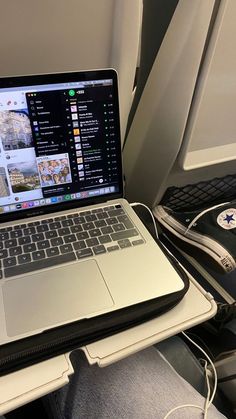 an open laptop computer sitting on top of a desk