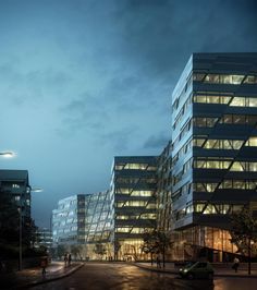 the building is lit up at night with people walking around it and cars parked on the street