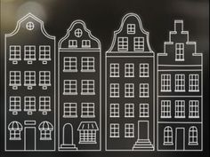 a black and white drawing of buildings on a glass surface with the outline of windows