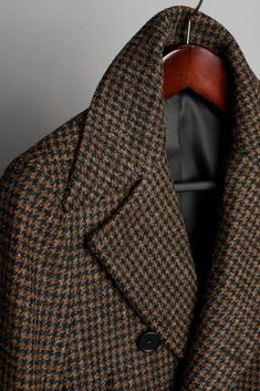 A handmade bespoke coat made from authentic Harris Tweed; in all of its rugged indestructible glory. This legendary fabric - the only cloth in the world protected by an act of British parliament to conserve its heritage and authenticity - is hand-woven on small looms and every batch is rigorously inspected. These fabrics are world famous for their warmth, color, texture and - most notably - their lifelong durability. Men's Overcoat, British Parliament, Peacoat Men, Polo Tee Shirts, Eggplant Color, Tuxedo Shirts, Bespoke Tailoring, Tweed Coat, Suit Shirts