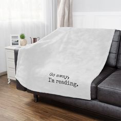 The "Go away, I'm reading." blanket is perfect for anyone who wants to snuggle up and get lost in a book! Created to be as soft as possible, this microfiber fleece blanket is made with 100% fluffy polyester. Available in 3 different sizes, these blankets are heavy-knitted with ultra-fine microfiber yarns for a luxurious feel to the touch. Reading Blanket, Tiny Library, Gifts Book, Book Tote Bag, Nerd Gifts, Book Jokes, Heavy Knit, Bookish Gifts, Cricut Creations