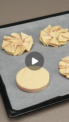 an uncooked batch of cookies on a baking sheet with the cookie being made