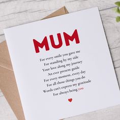 a card with the words mum written on it and a plant in front of it