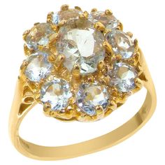 This ring is made from 375 9K Yellow Gold with Natural Aquamarine. *Total Height 8mm, Width 14mm, Height 15mm This is a stunning ring -- One large 7x5 mm (0.28" x 0.20") and eight 3.5mm (0.14") round Very Vibrant Sparkling Aquamarines set in this Solid 9K Gold Large cluster setting. Follow the ring around and you get a nice thick shank which indicates a quality design and is good for durability and comfort -- you need to see this for yourself as the pictures do not give this ring the justice it Ice Blue Color, Birthday Gemstones, Mens Band Rings, Freshwater Pearl Ring, Cluster Engagement Ring, Engagement Ring Sizes, Diamond Cluster Ring, Natural Aquamarine, Cluster Ring