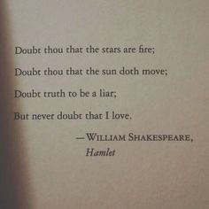 an open book with shakespeare hamlet written on it