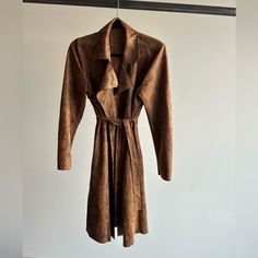 Never Worn. Size Small. Faux Suede Trench Coat. Brown Belted Outerwear For Fall, Brown Belted Long Coat, Brown Belted Long Coat Outerwear, Belted Brown Outerwear For Fall, Belted Brown Long Coat Outerwear, Belted Long Brown Coat, Fitted Brown Belted Outerwear, Spring Camel Long Coat, Chic Brown Outerwear With Lapel Collar