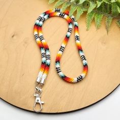 This lanyards for badge holders is made of Japanese seed beads of superior quality beads.Lanyards are perfect for keys, ID cards, badges, name tags, keychains, usb, passport, whistle, compass, ticket, camera, phone, wallet.*SIZE:Lanyard lenght : 28 incLenght with holder: 15 incAll products are 100% handmade, made with love especially for you.Piece of my soul, which I left in this work, will warm you even in the most difficult and sad days. I am sure; this jewelry will become your lucky charm tha Beaded Badge Holders, Teacher Lanyards, Beaded Lanyard, Beaded Necklace Designs, Teacher Lanyard, Lanyard Keychain, Key Lanyard, Beaded Lanyards, Beaded Rope