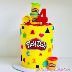 a birthday cake made to look like a play doh can with the number four on it