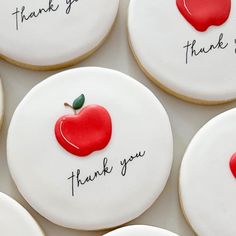 thank you cookies with an apple on top and writing on the outside are arranged in rows