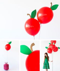 a woman in a green dress is holding red balloons that are shaped like two apples