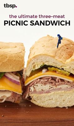 two sandwiches cut in half sitting on top of a wooden cutting board with the words picnic sandwich