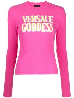 Versace slogan-print long-sleeve T-shirt - Farfetch Pink Long Sleeve T-shirt With Graphic Print, Pink Long Sleeve Slogan Top, Pink Long Sleeve Top With Slogan, Pink Long Sleeve T-shirt With Text Print, Long Sleeve Tops With Logo Lettering For Streetwear, Pink Long Sleeve T-shirt With Letter Print, Pink Long Sleeve Top With Logo Print, Pink Long Sleeve T-shirt With Text, Pink Fitted Top With Logo Print