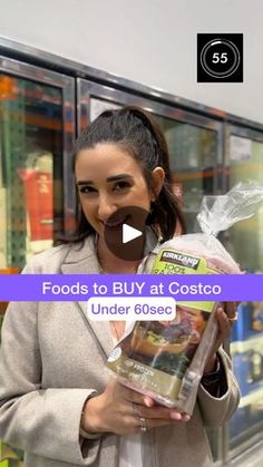 a woman holding up a bag of food in front of her face and the words foods to buy at costo under 60cc