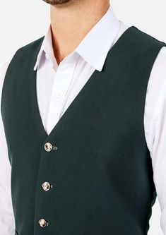 This Emerald Green Vest is designed with stretch cotton for comfort, and features a stylish deep green hue that stands out in a sea of blues without being over the top. One of our crowd favorites, this is a great choice to add to your wardrobe. Classic Green Vest For Winter, Classic Green Winter Vest, Casual Green Work Vest, Formal Cotton Vest For Fall, Green Fitted Classic Vest, Classic Green Cotton Outerwear, Fitted Green Cotton Outerwear, Green Winter Workwear Vest, Winter Workwear Green Vest