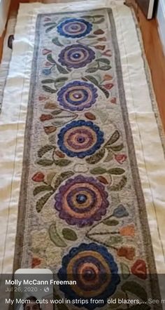 a long table runner with colorful flowers on it