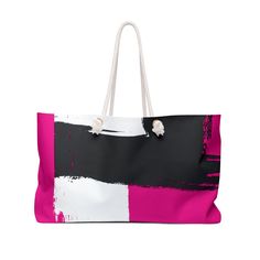 a pink and black tote bag with white handles