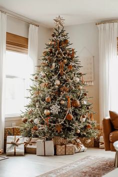 a decorated christmas tree in a living room